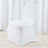White chair cover on a plain backdrop with scattered petals.