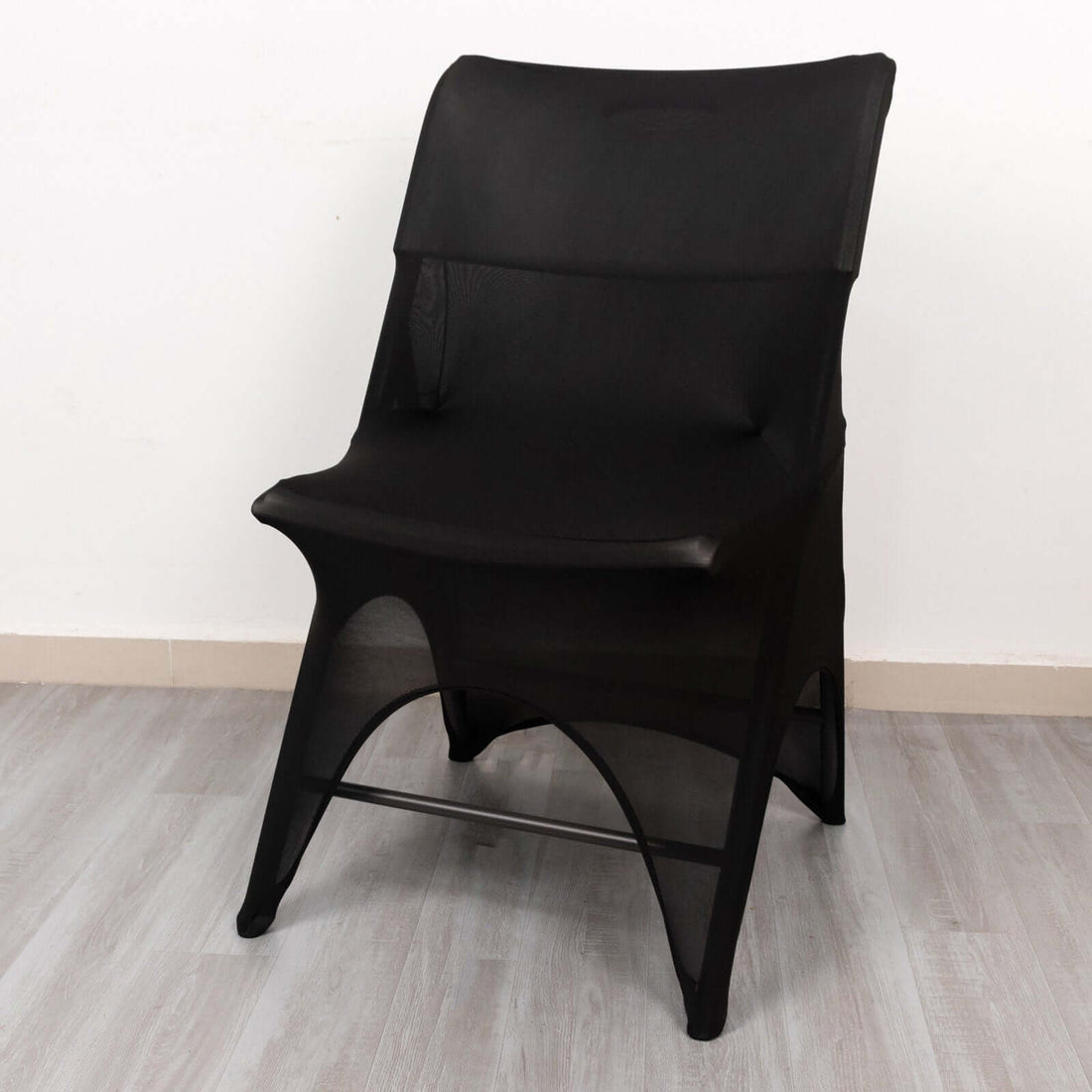 Black mesh chair on a plain background