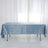 Blue velvet tablecloth draped over a table in a bright, airy setting.