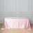 Pink tablecloth draped elegantly on a table in a styled room setting.