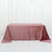 Pink satin tablecloth on a white backdrop.