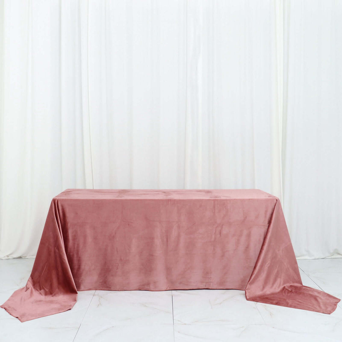 Pink satin tablecloth draped elegantly over a table