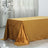 Gold tablecloth draped elegantly over a rectangular table.