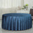 Round navy blue tablecloth on a table in a stylish interior setting.