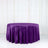 Purple round tablecloth on a white backdrop.