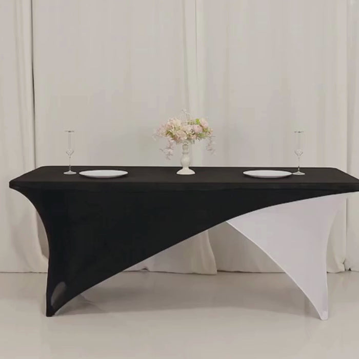 Black and white stretch spandex table cover with elastic foot pockets.