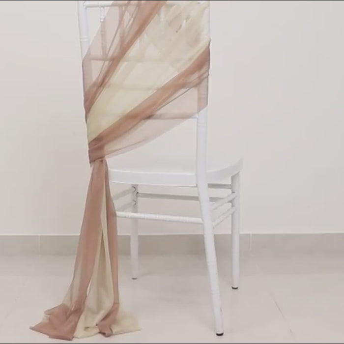 Taupe beige sheer chair sash draped elegantly on a white chair.