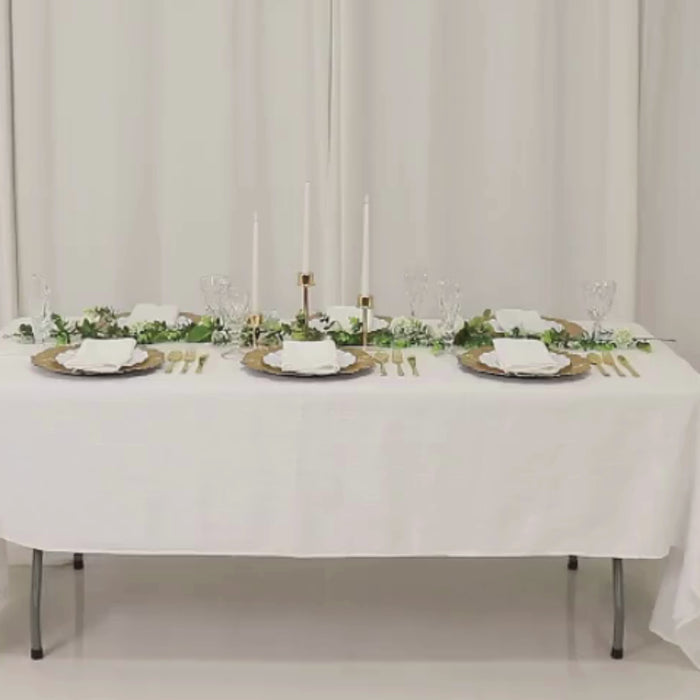 Gold charger plates with reef design on a table setting.