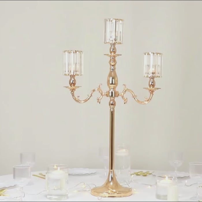Gold metal candelabra with crystal shades, 40" tall candle holder.