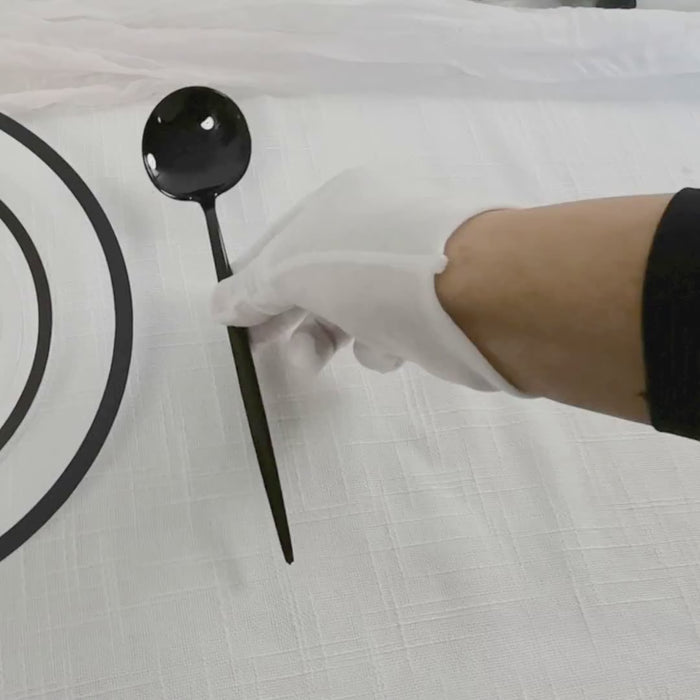 Black disposable plastic utensil set with sleek cutlery design.