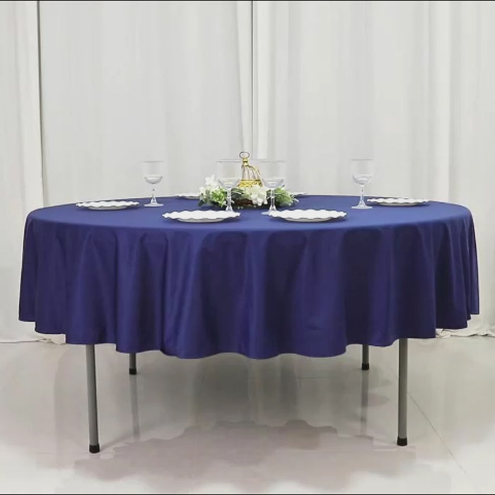 Navy blue fire retardant round tablecloth, wrinkle-free and stain resistant.
