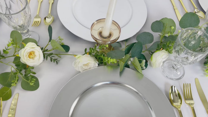 Metallic silver charger plates for elegant dining table settings.