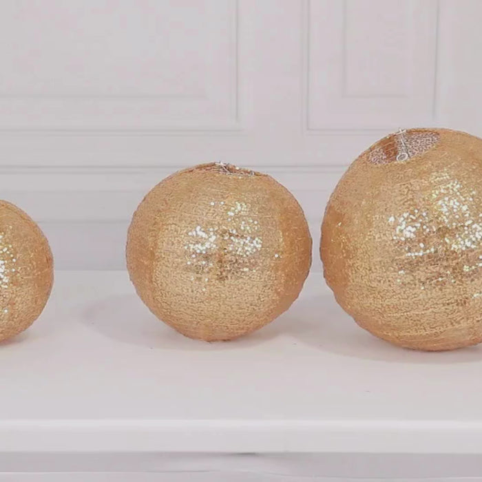 Shimmer gold sequin fabric hanging lanterns in three sizes: 8", 10", 12".