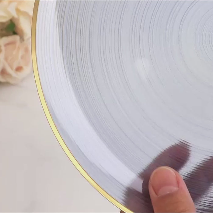 Transparent dusty blue bowl with gold rim, elegant crystal-like swirl design.
