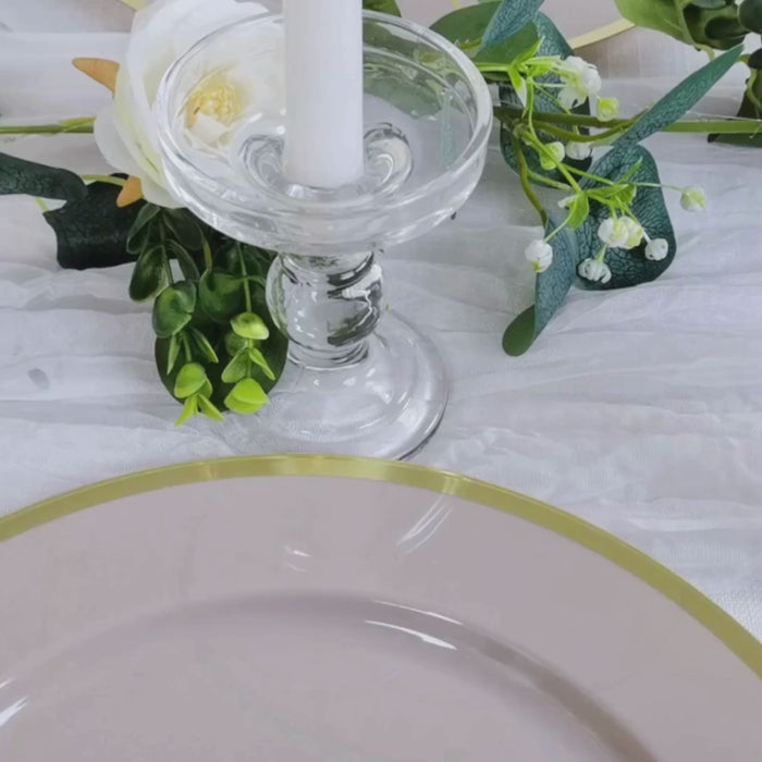 Taupe charger plate with gold rim on elegant tabletop decor.