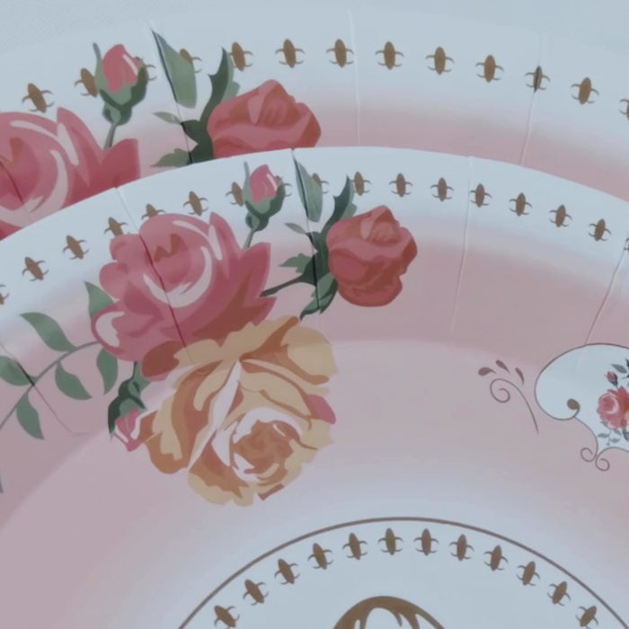 Dusty rose dessert plates with vintage rose print for celebrations.