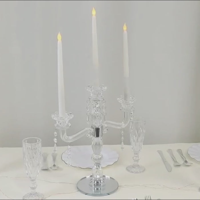 Crystal 3-arm candelabra taper holder with hanging prisms on a round mirror base.