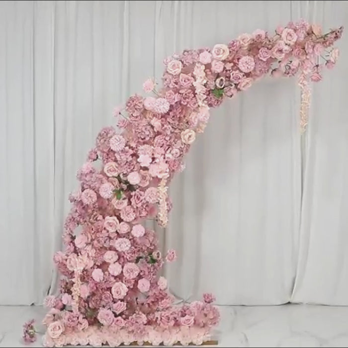 Dusty rose floral backdrop for a wedding arch with artificial flowers.