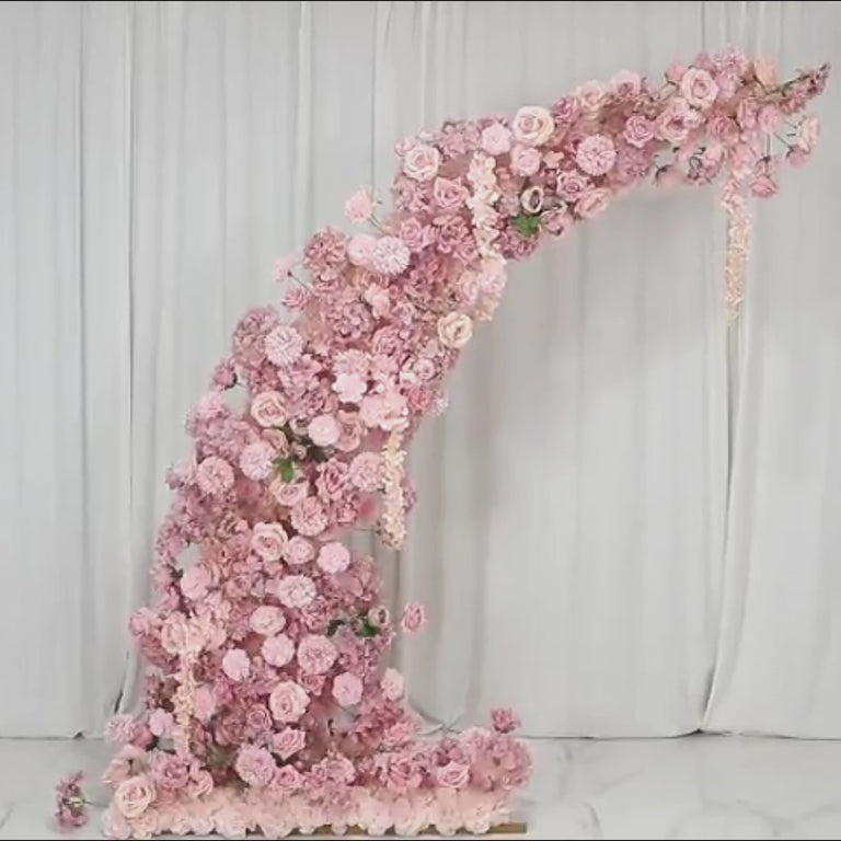 Dusty rose floral backdrop for a wedding arch with artificial flowers.
