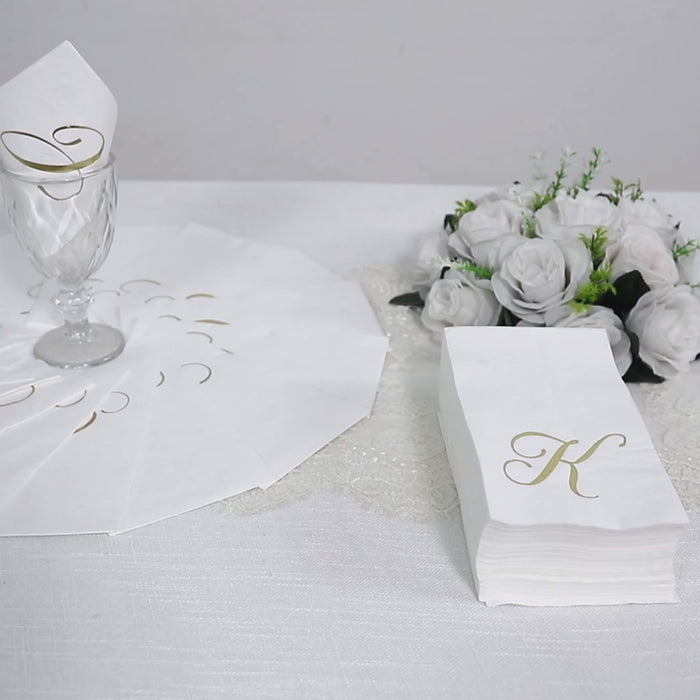 White paper dinner napkins with gold foil monogram "A".