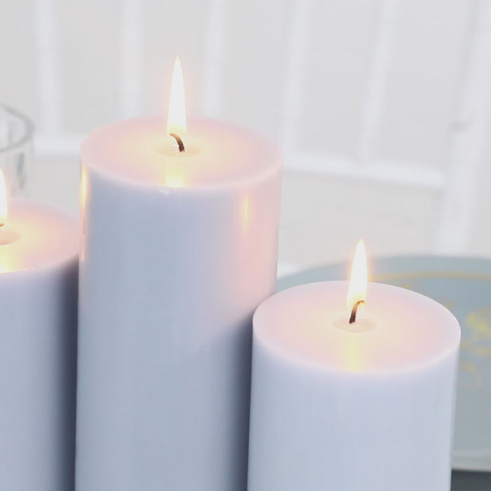 Dusty blue unscented pillar candles with smokeless cotton wicks.