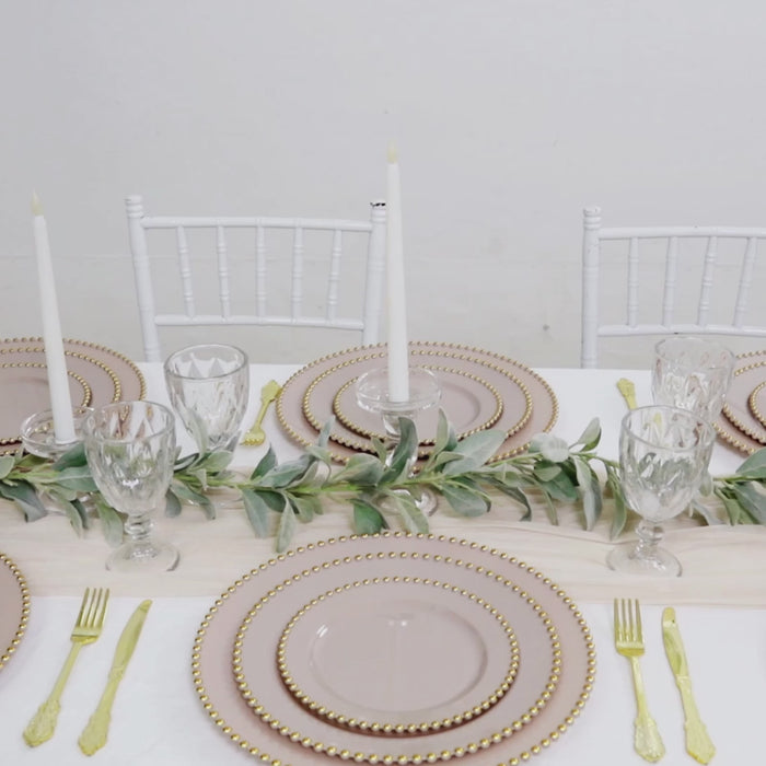 Taupe disposable dinner plates with gold beaded rim on a stylish table setting.