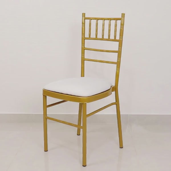 White spandex Chiavari chair cushion cover on a gold chair.