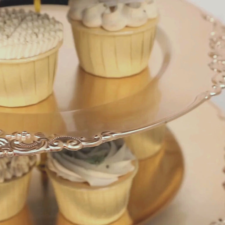 Metallic gold 3-tier cupcake stand with decorated cupcakes.