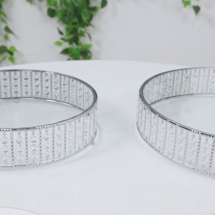 Silver crystal cake stand with hanging beads and glass top.