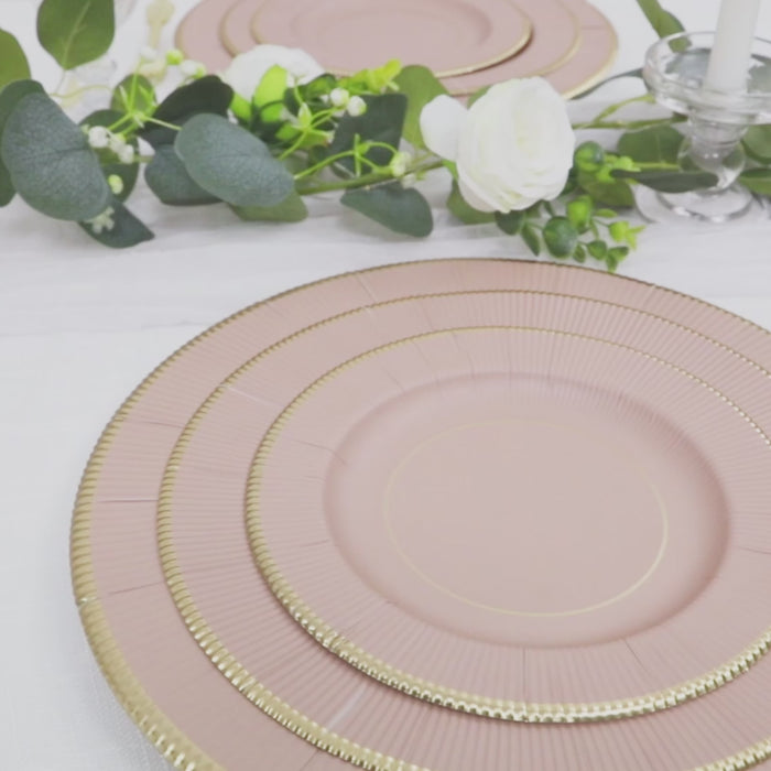 Dusty rose charger plates with gold rim, perfect for elegant table settings.