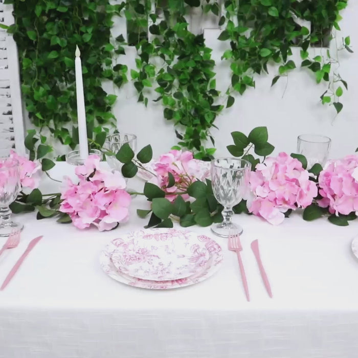 Pink artificial hydrangea garland with greenery for table decor.