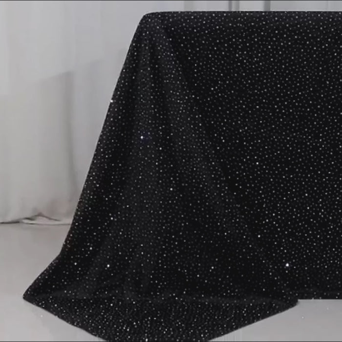 Black tablecloth with rhinestone accents, wrinkle-free and stain-resistant.