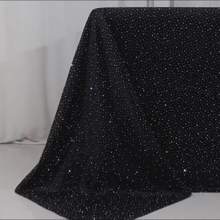 Black tablecloth with rhinestone accents, wrinkle-free and stain-resistant.
