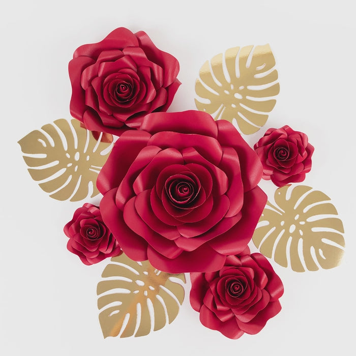 Set of 9 red 3D rose paper flowers with gold monstera leaves decor.