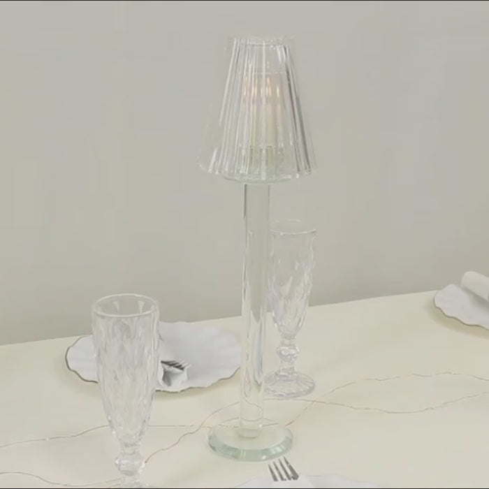 Clear crystal glass candle holders in vintage lamp shape.