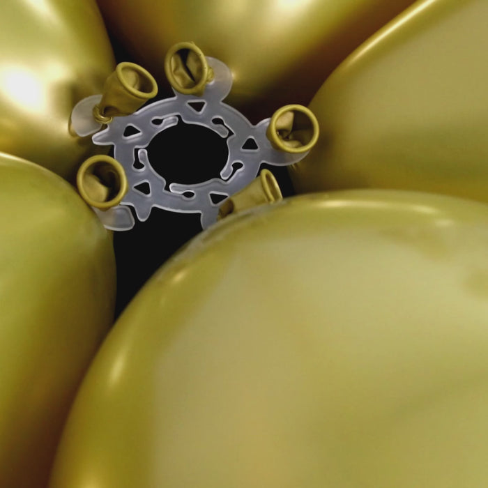 Clear balloon clips for party decorations with gold balloons.