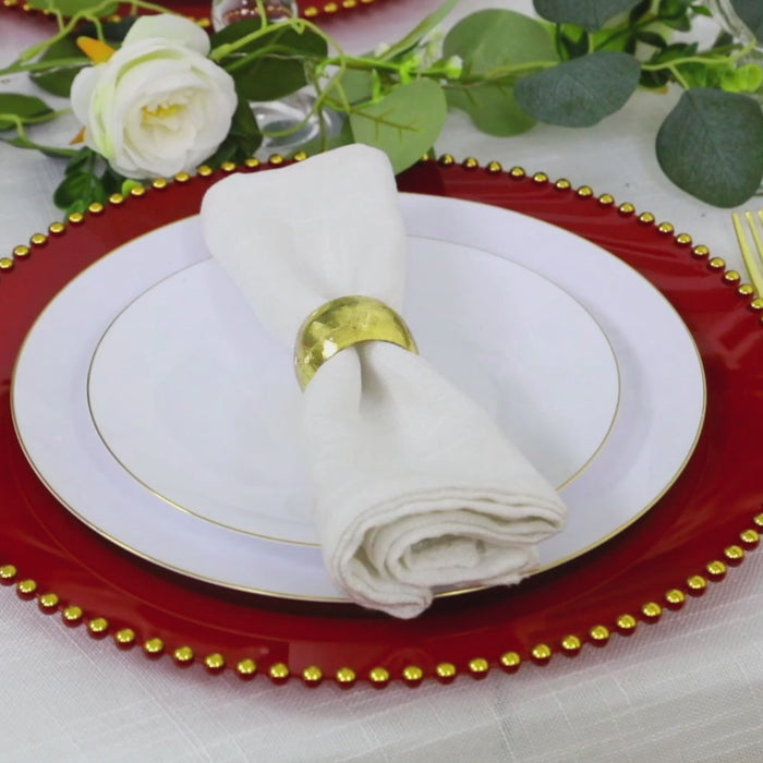 Red charger plate with gold beaded rim, ideal for stylish dinner parties.