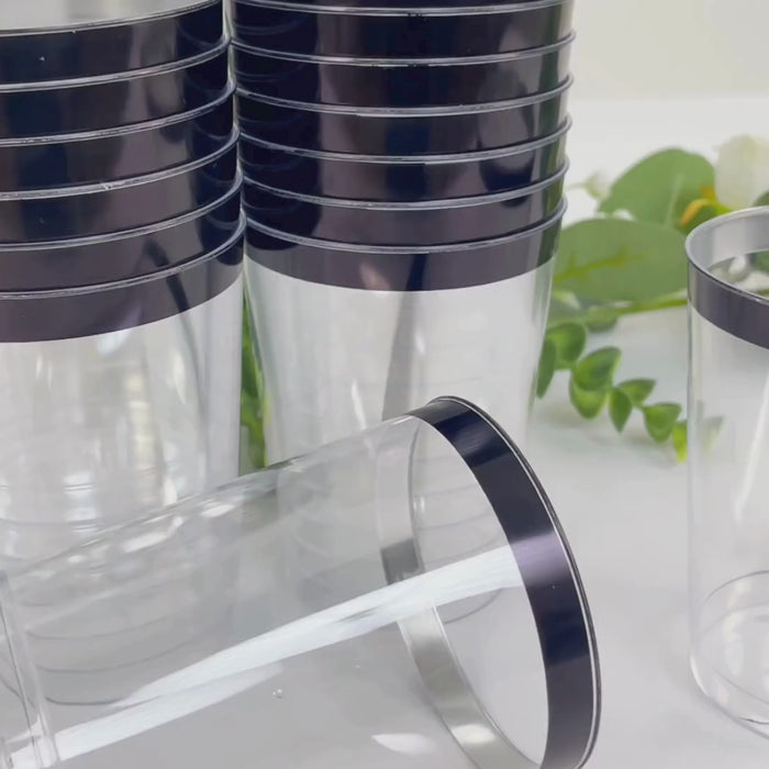 Clear plastic tumbler cups with black rim, perfect for parties.