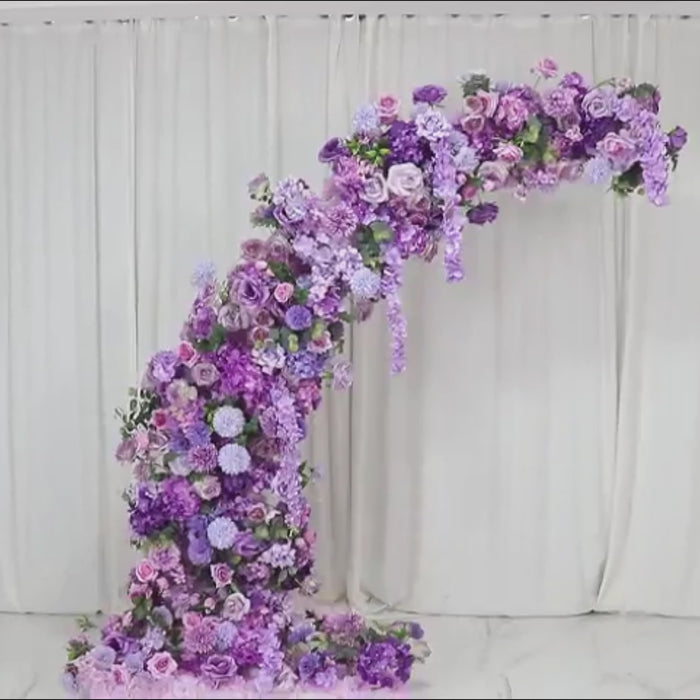 Lavender floral backdrop for a half crescent wedding arch with roses and hydrangeas.