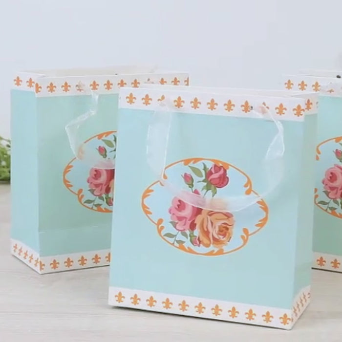 Turquoise vintage rose floral gift bags with ribbon handles.