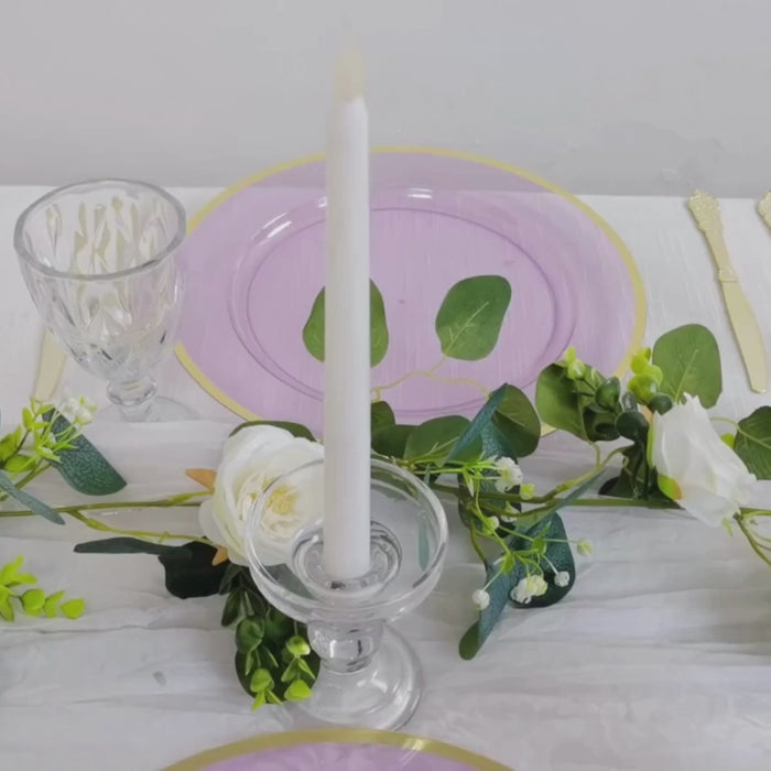 Purple charger plate with gold rim on a decorated event table.