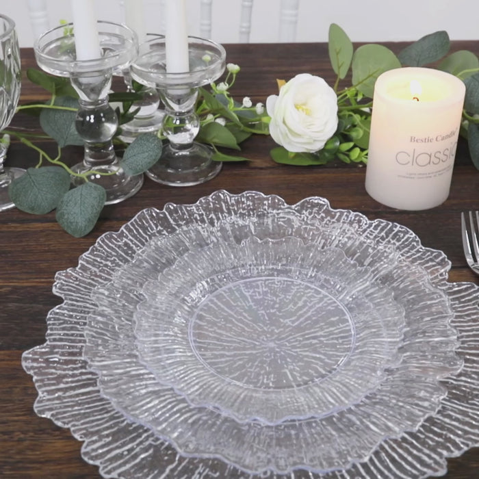 Clear reef design plastic plates on a wooden table, perfect for elegant parties.