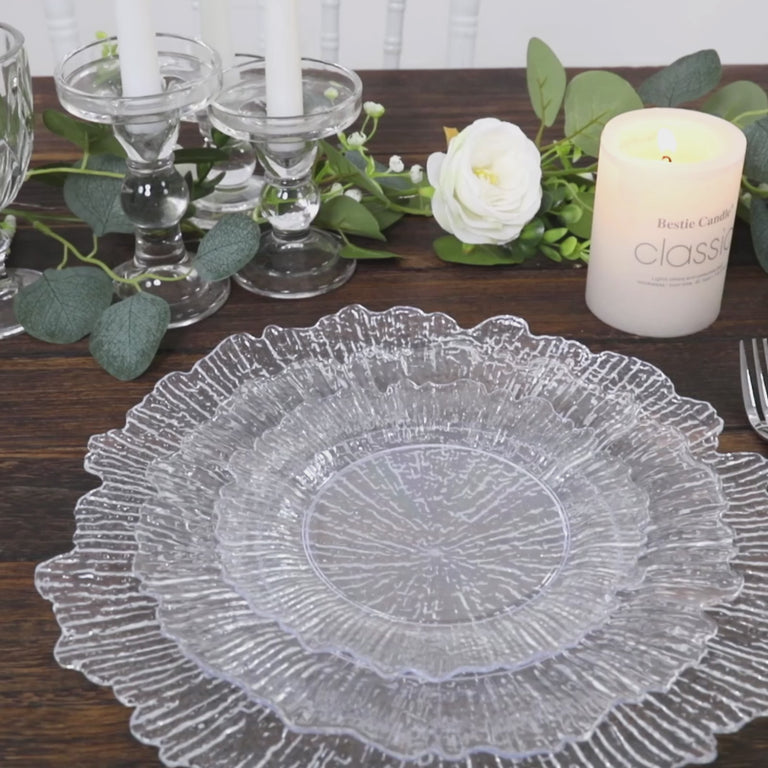 Clear reef design plastic plates on a wooden table, perfect for elegant parties.