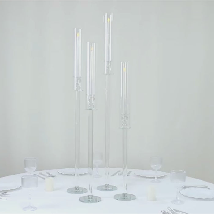 Clear crystal glass hurricane candle holders, decorative tall stands.