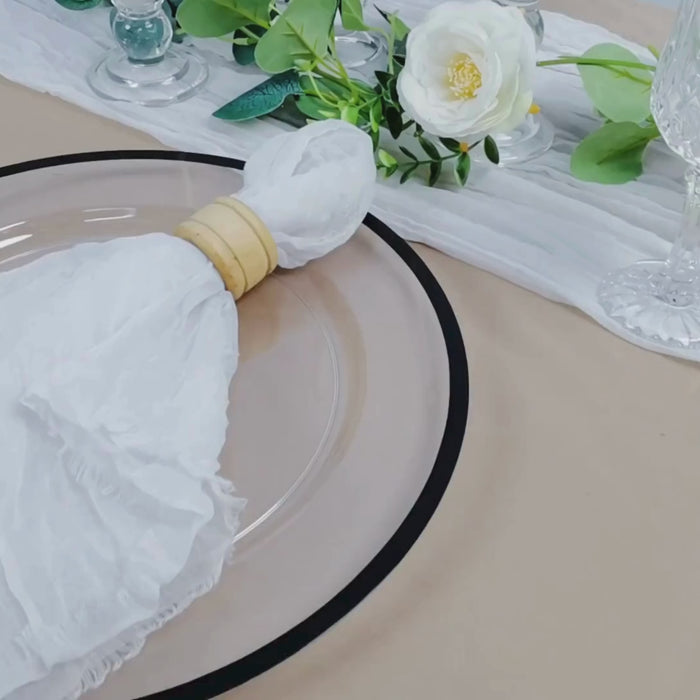 White reusable cheesecloth napkin on a rustic table setting.