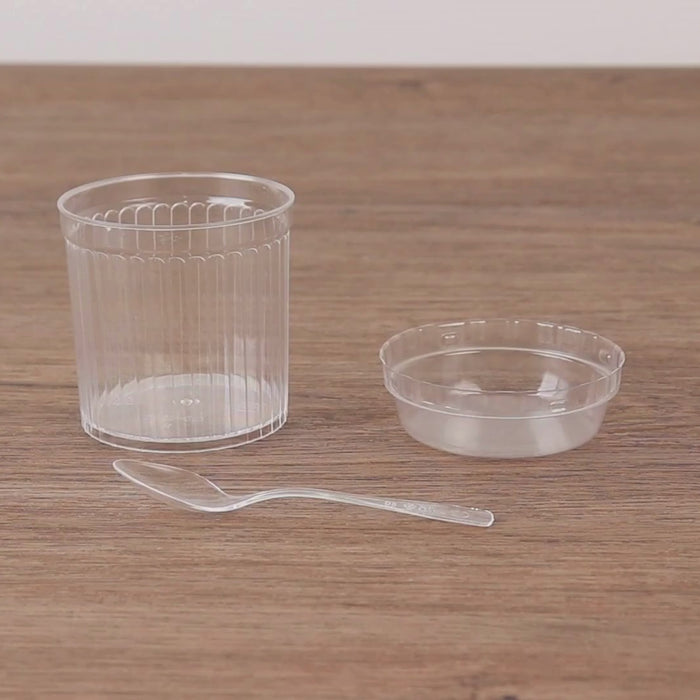 Clear ribbed plastic fruit dessert cups with lids and spoons.