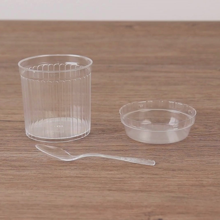 Clear ribbed plastic fruit dessert cups with lids and spoons.