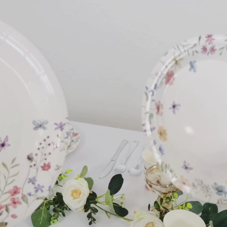 White paper plates and cups with wildflower butterfly print for parties.