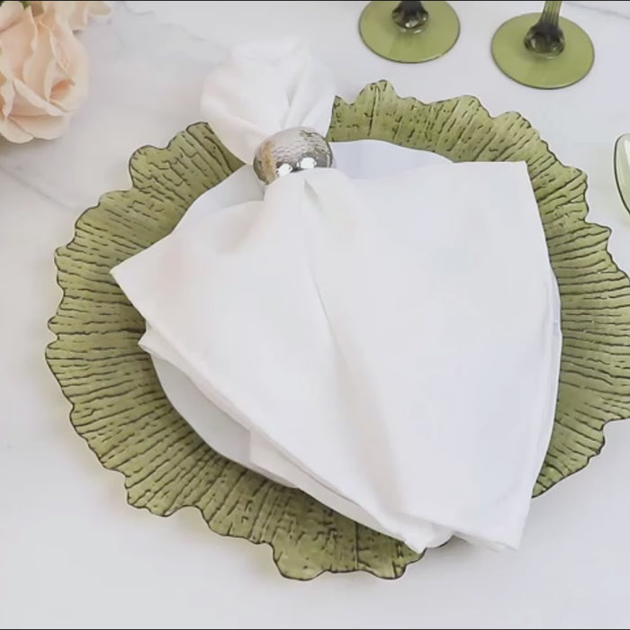 Dusty sage green decorative charger plate with a reef design.