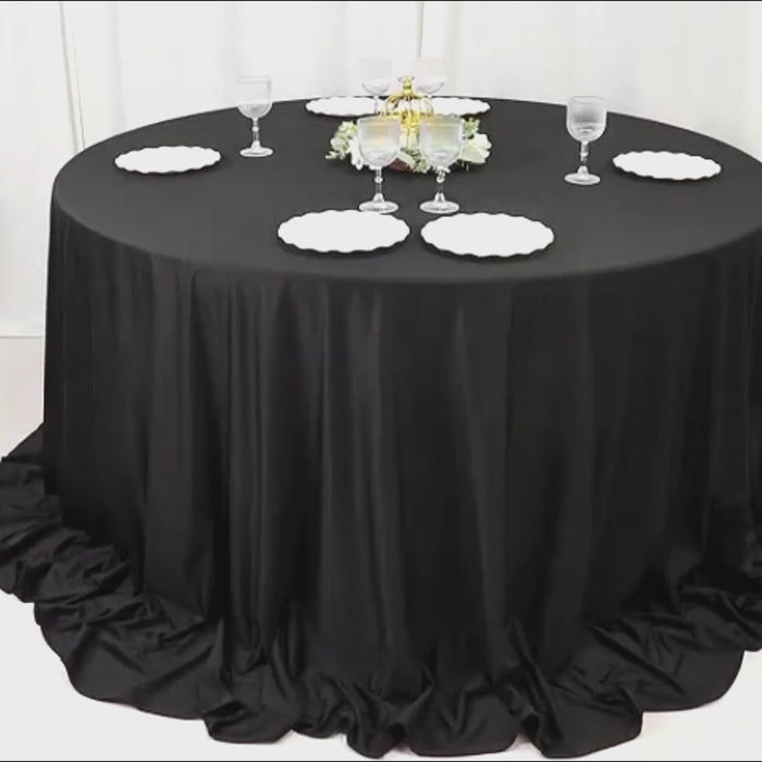 Black round scuba polyester tablecloth, wrinkle-free and stain-resistant.